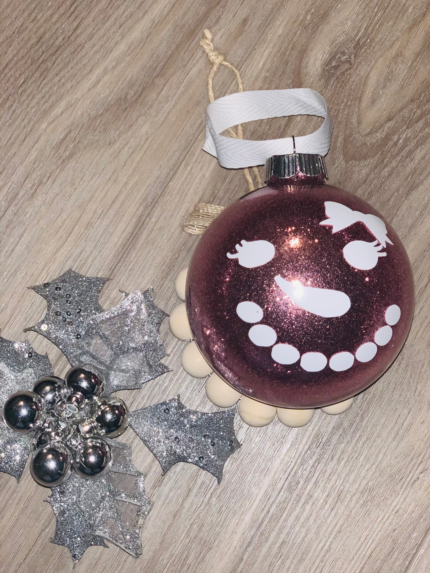 Large glass ornament with girl snow man face.