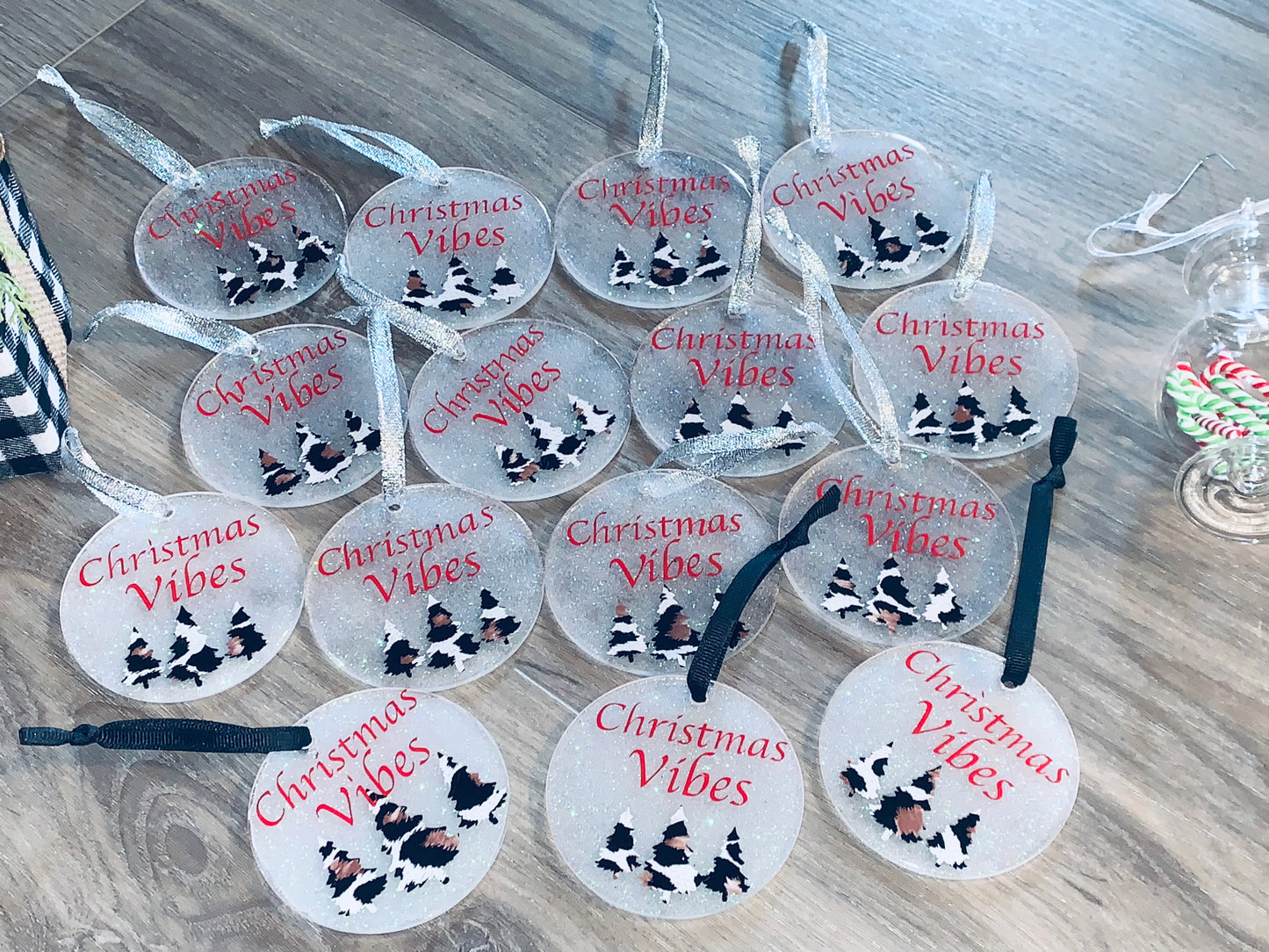 Acrylic Ornaments of vinyl trees and saying of Christmas Vibes.  Glitter and UV resin added